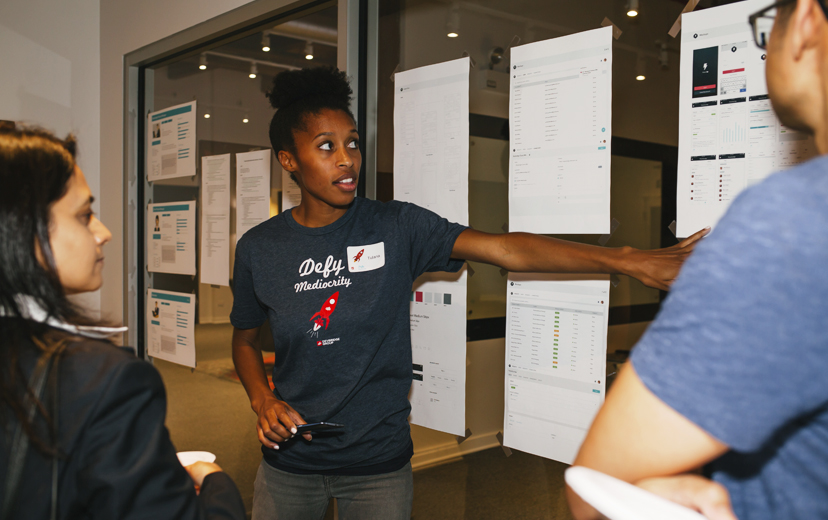 Small groups walk through the Devbridge design and development process